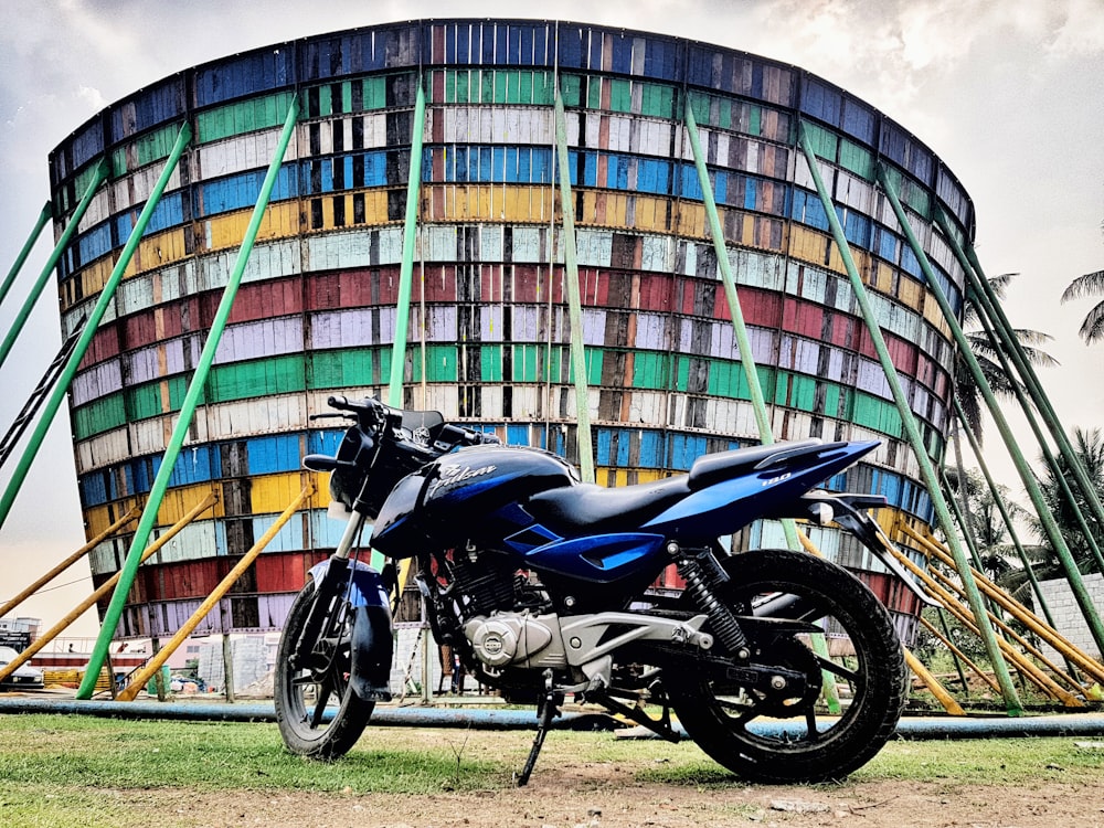 a motorcycle parked in front of a multicolored building