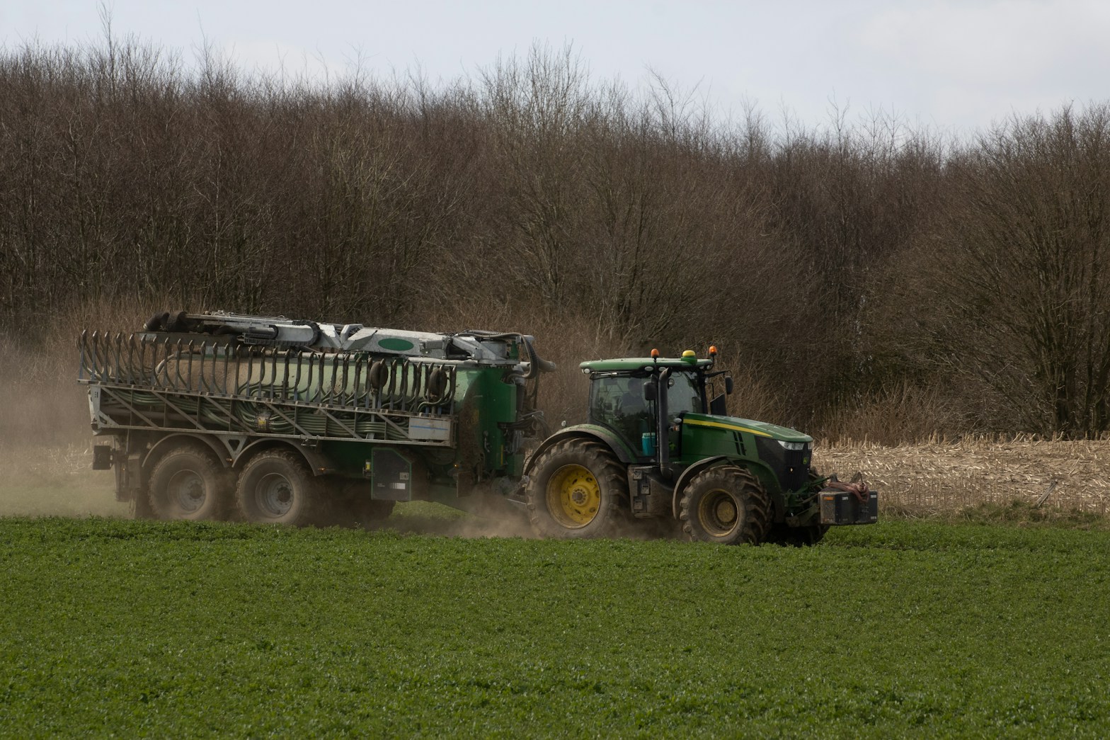 John Deere tractor towing a slurry tanker