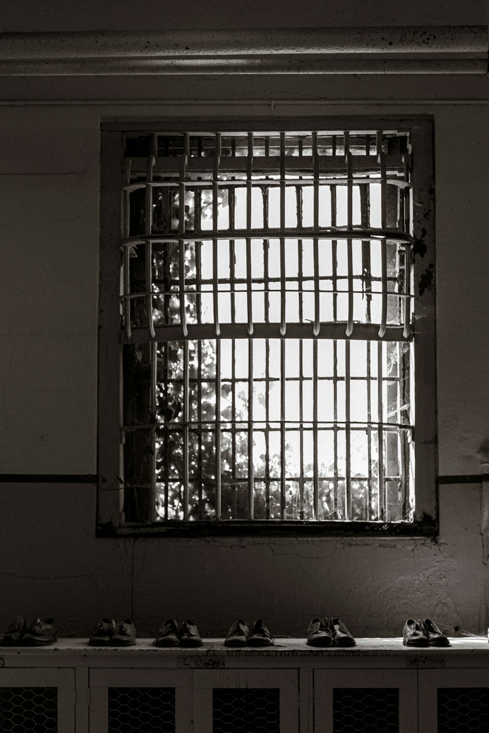a window with bars on the side of it