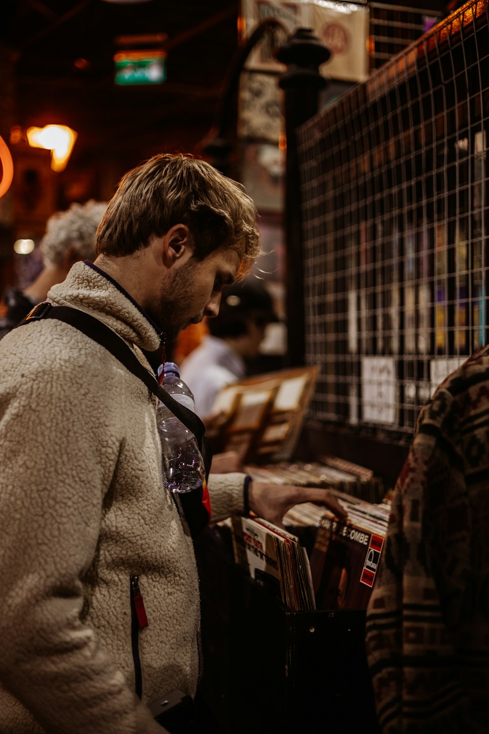 a man standing in front of a record player