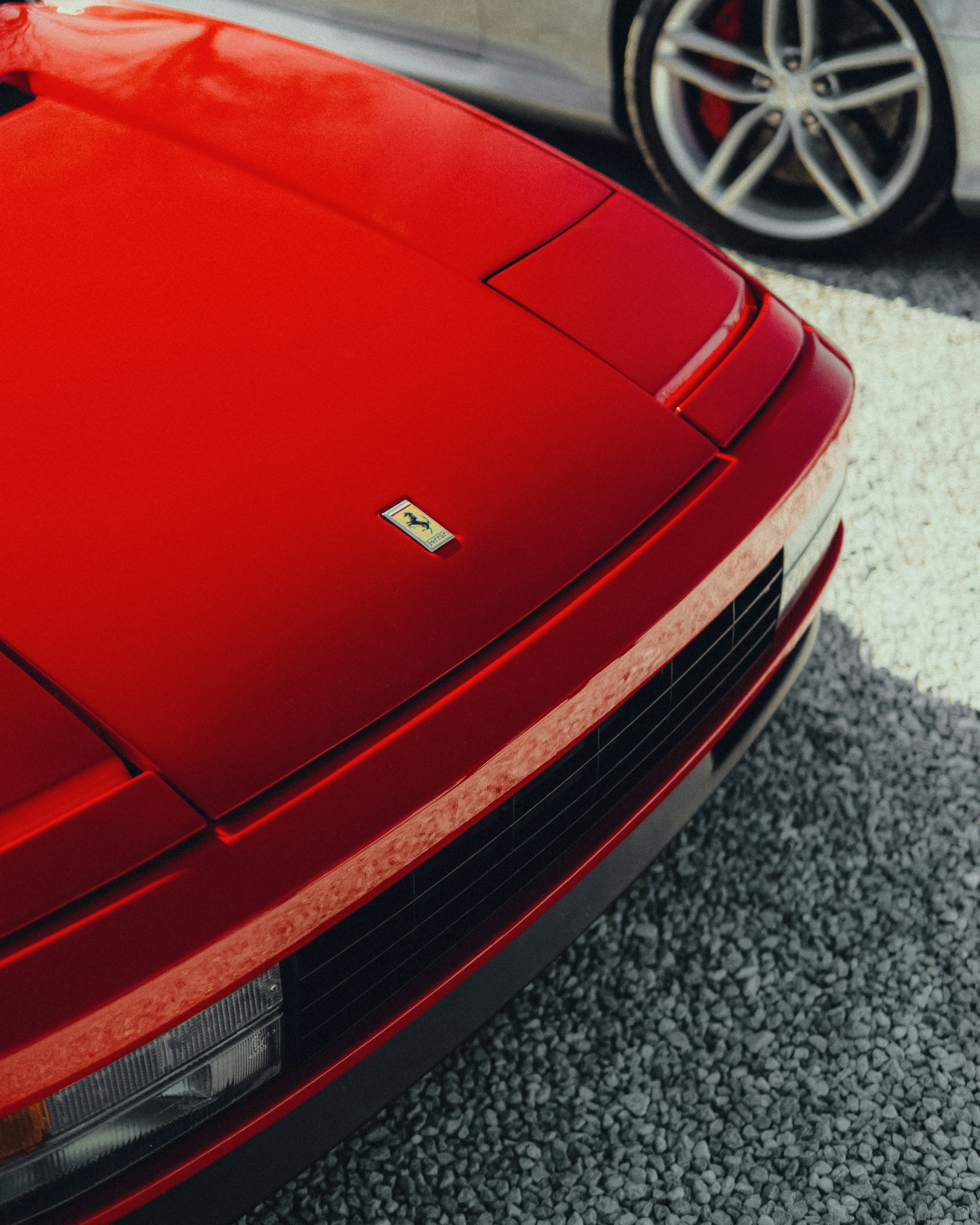 a red sports car parked in a parking lot