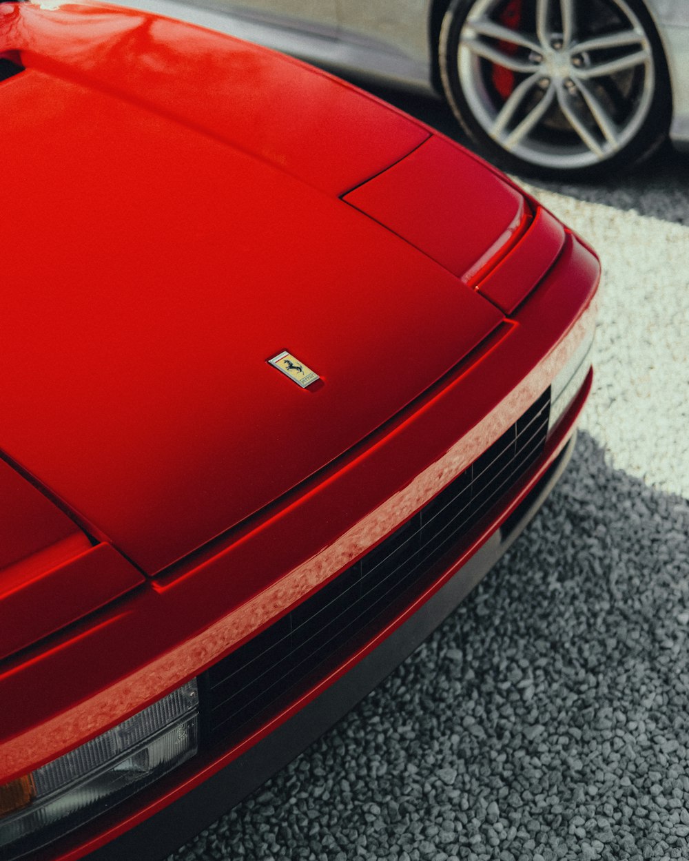 a red sports car parked in a parking lot