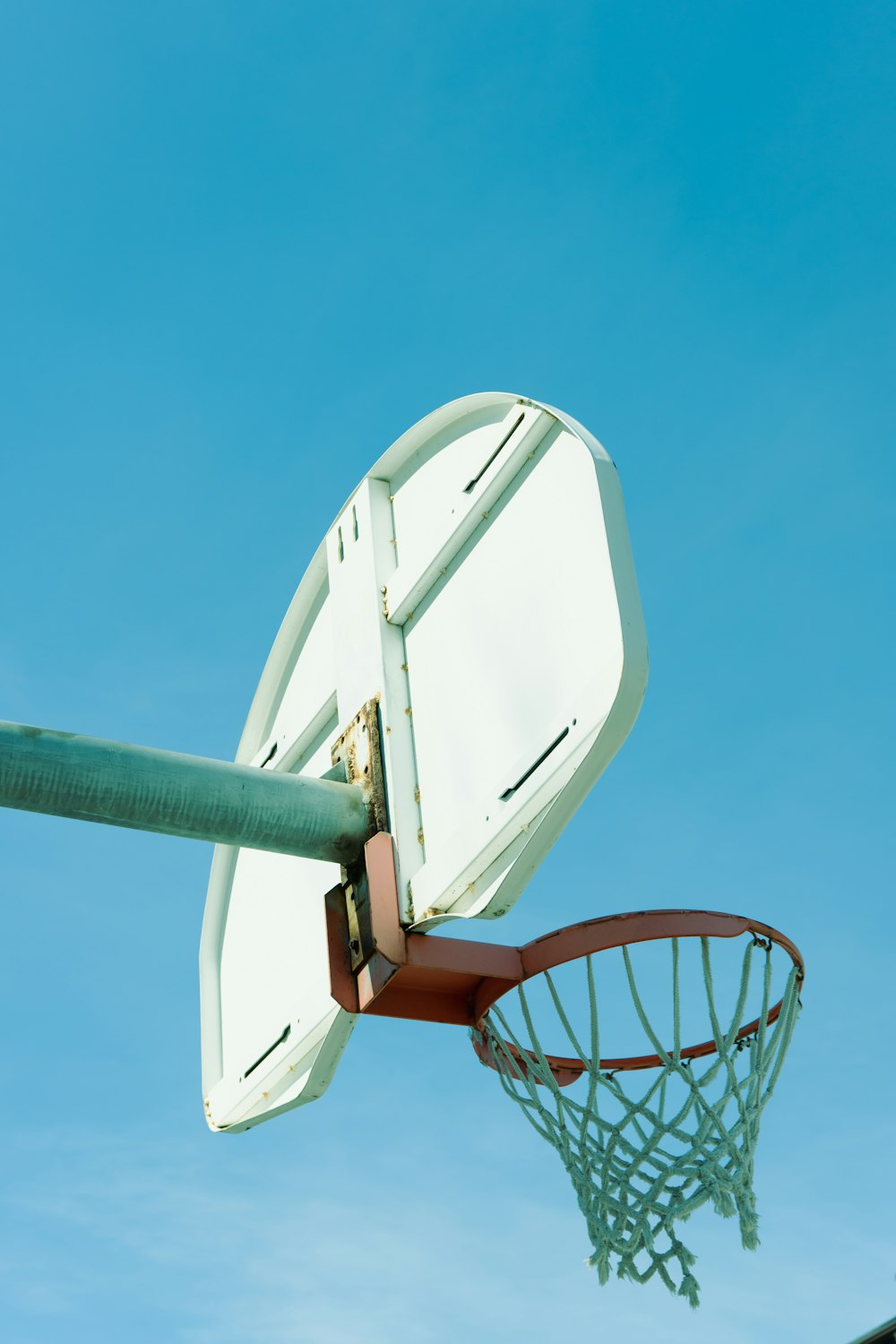 a basketball hoop with a basketball going through it