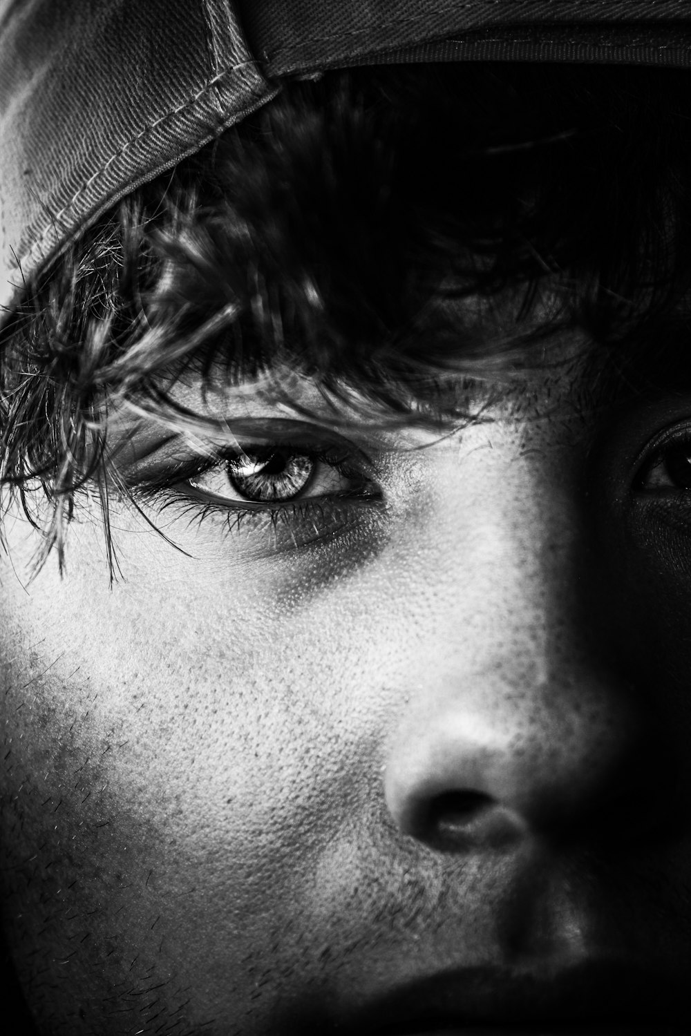 a close up of a person wearing a hat