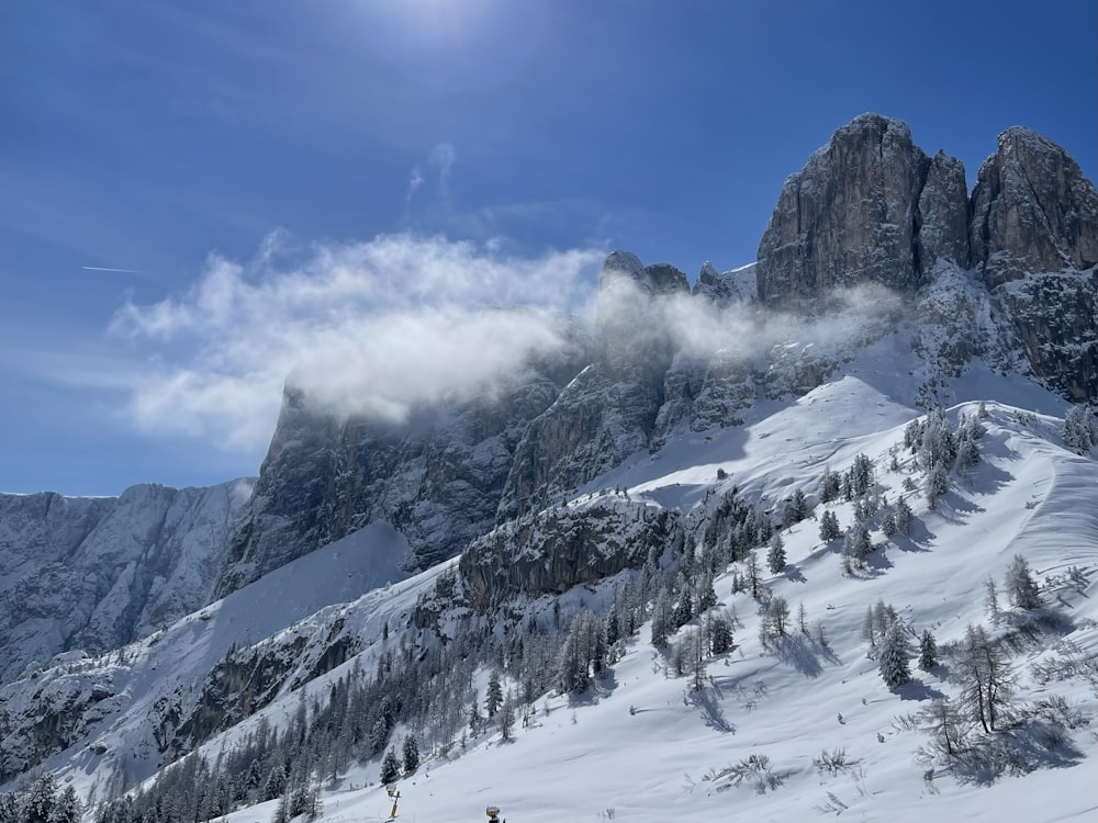 a person skiing down a snow covered mountain