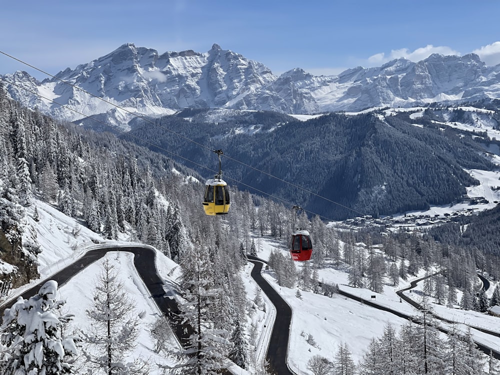 a ski lift going up a snowy mountain