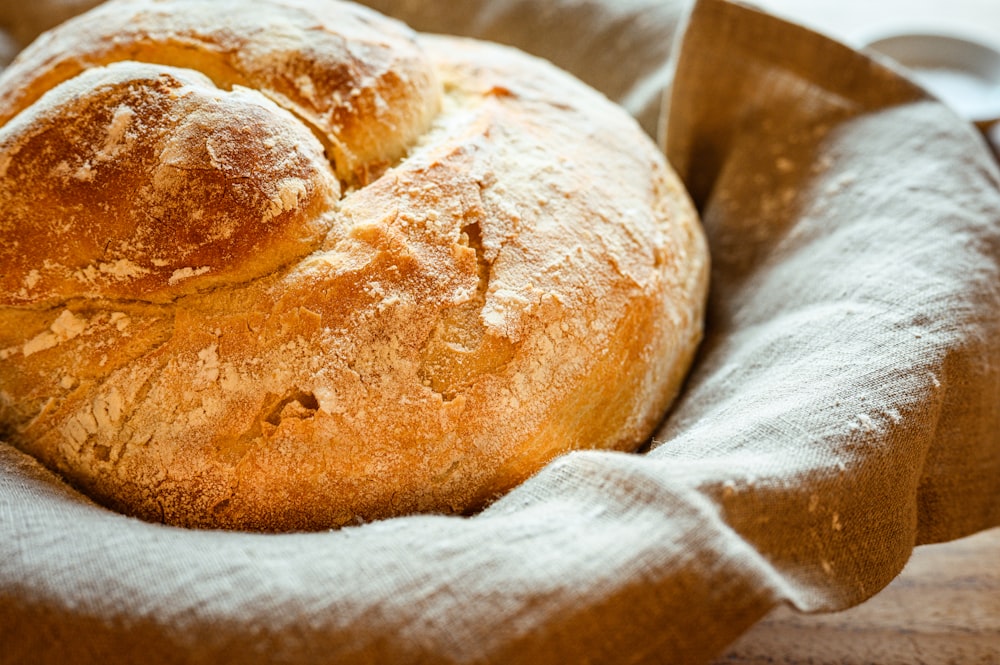 a loaf of bread sitting on top of a cloth