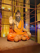 A warm portrait of the founder sitting peacefully in a sunlit Bali garden, embodying calm and openness.