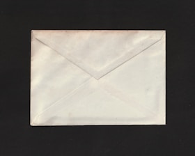 A close-up of a secure envelope with a label ready for dispatch.