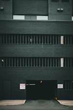 a black building with a sign on the side of it