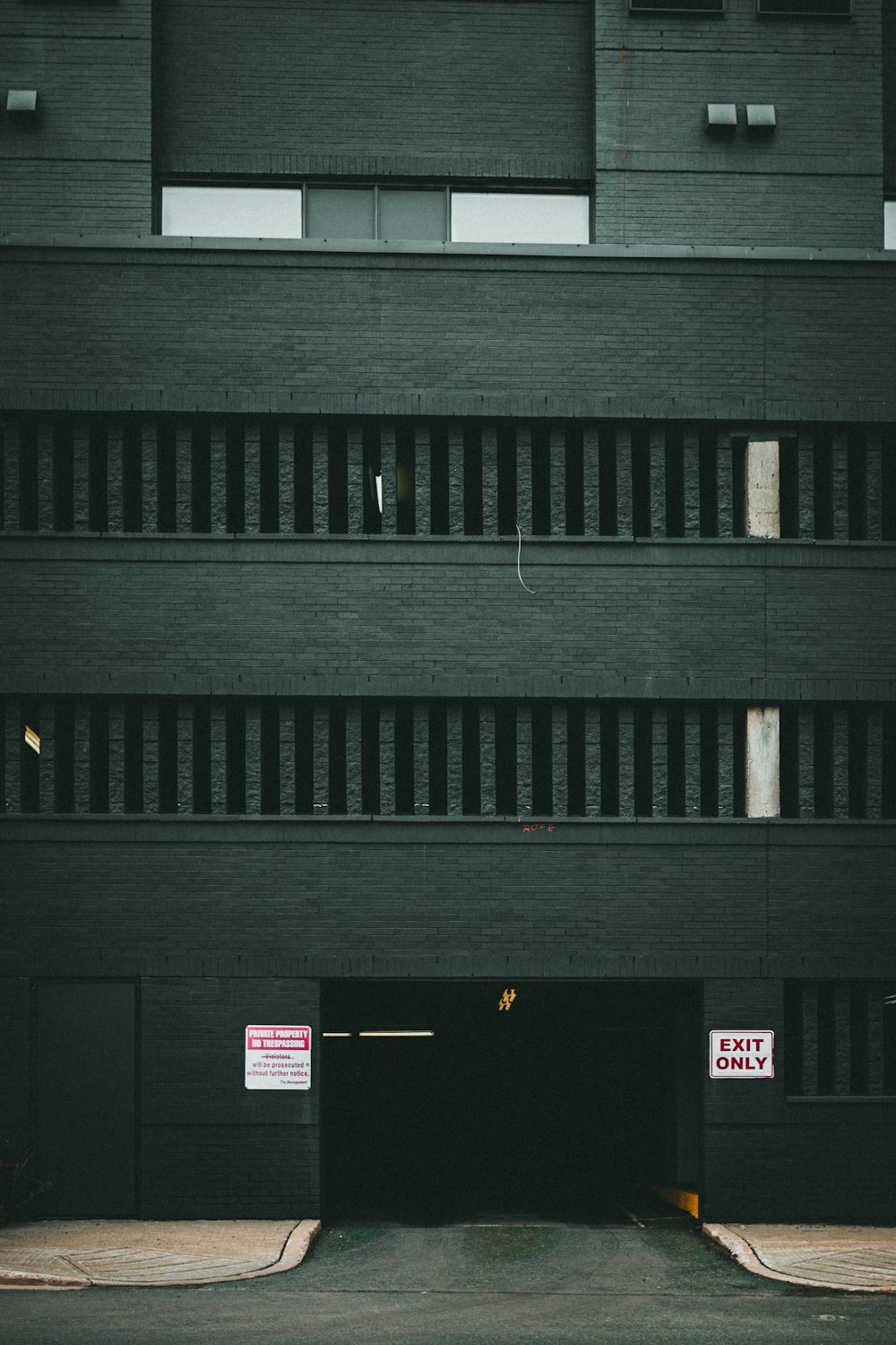 a black building with a sign on the side of it