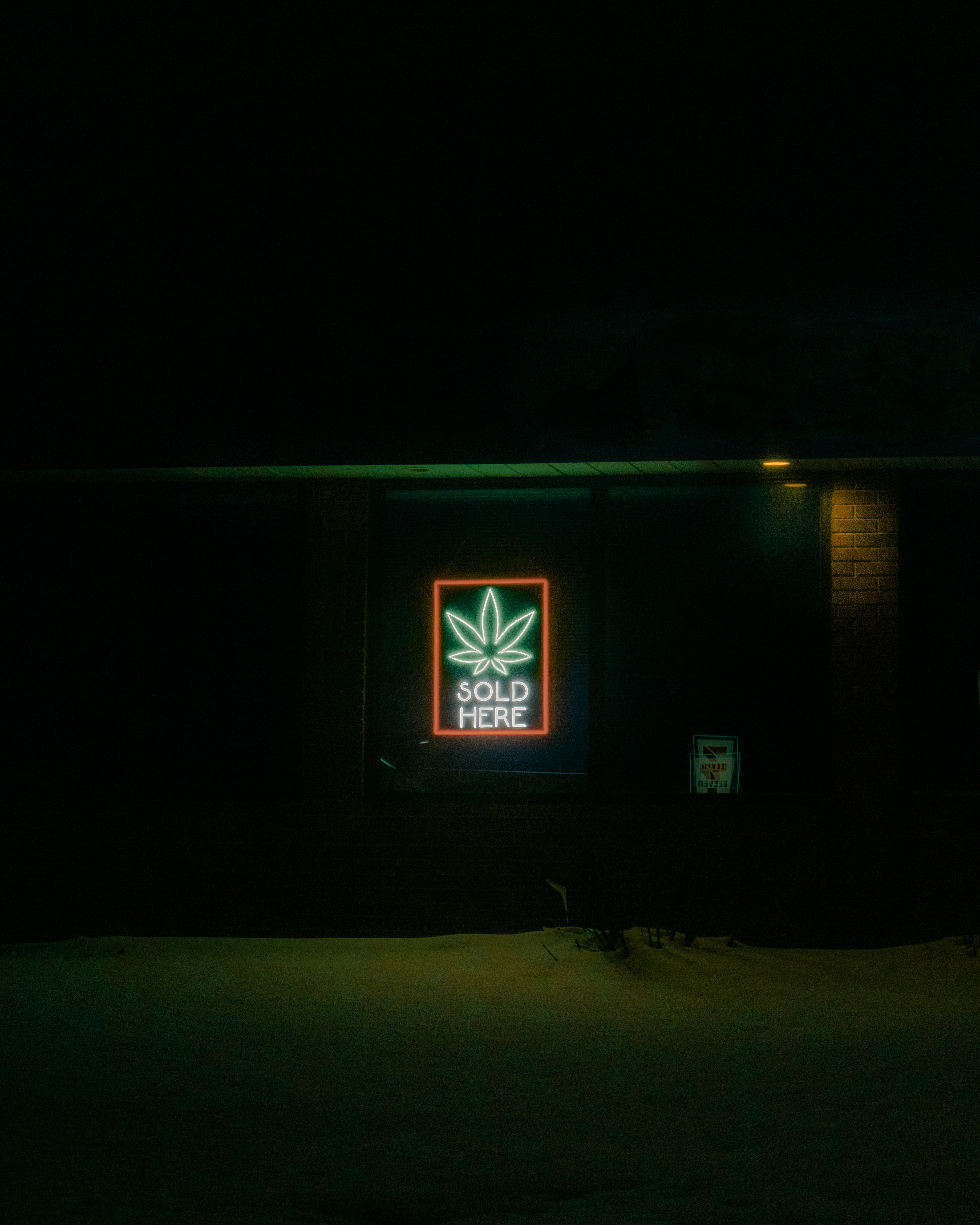 a building that has a neon sign on it