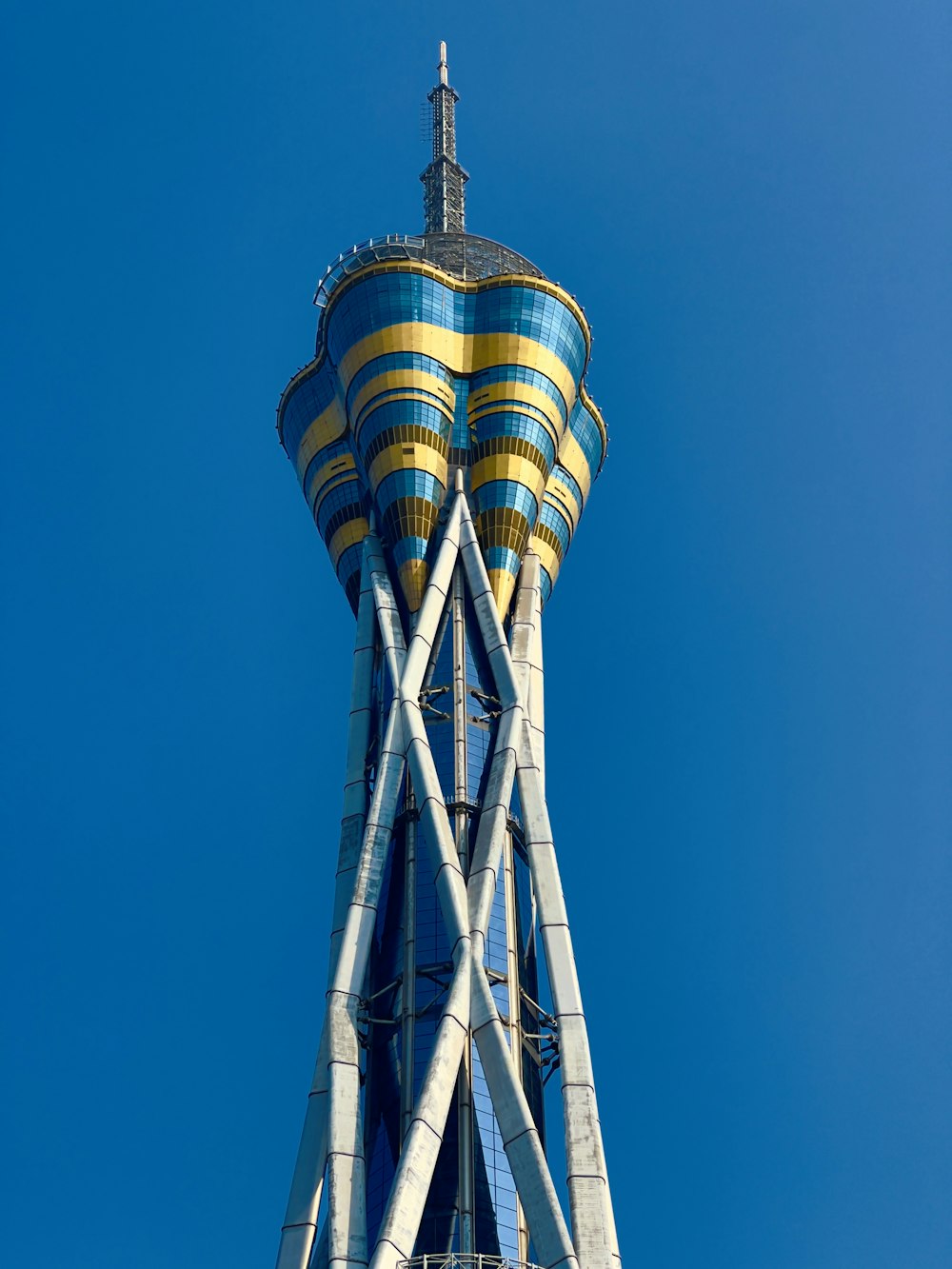 a very tall tower with a clock on it's side