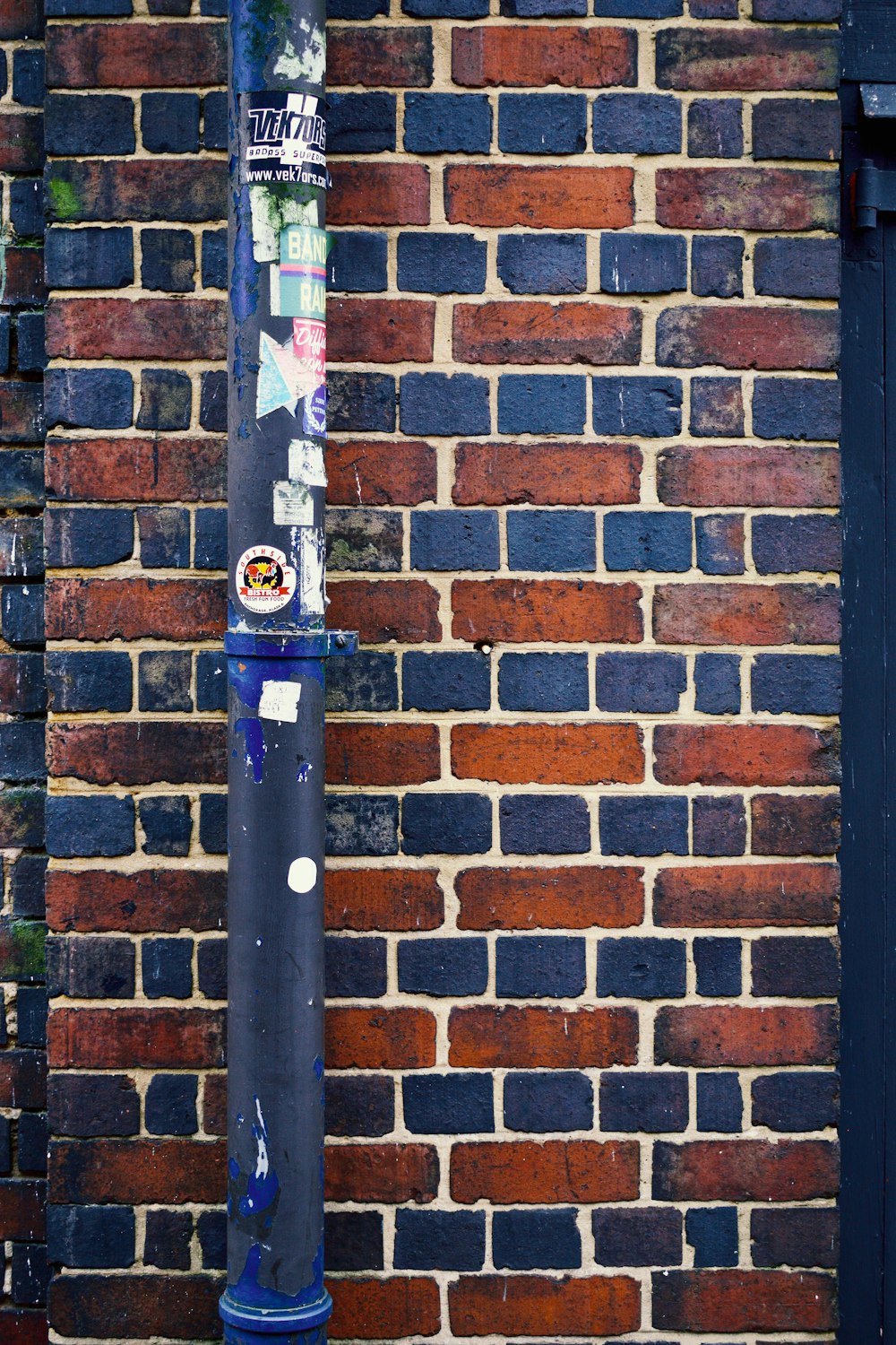 a baseball bat leaning against a brick wall