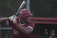 Close-up of a player’s hands gripping the bat, ready to swing with confidence.