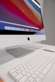a computer monitor sitting on top of a white desk
