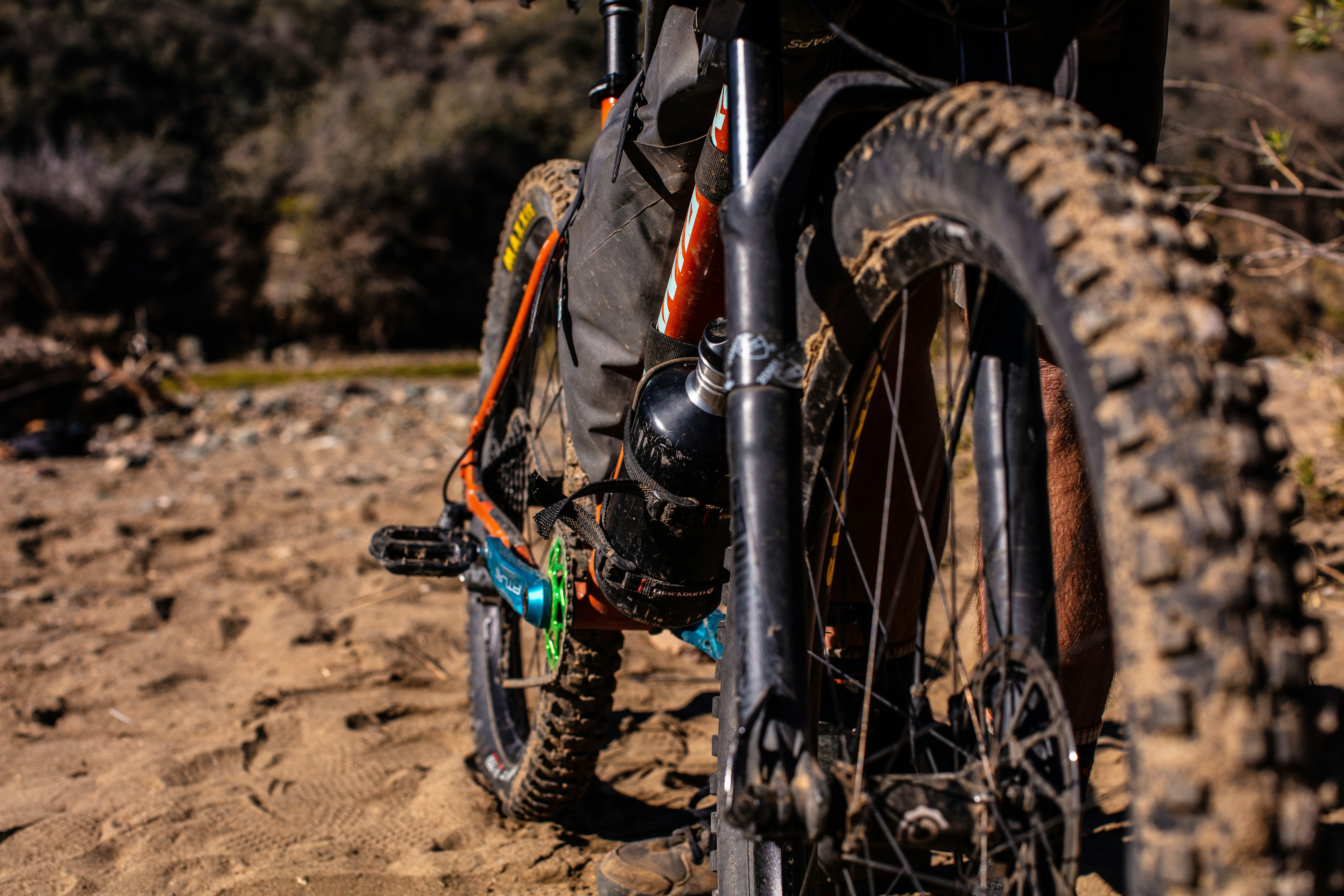 a person riding a bike on a dirt trail