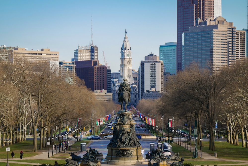 a view of a city with a statue in the middle