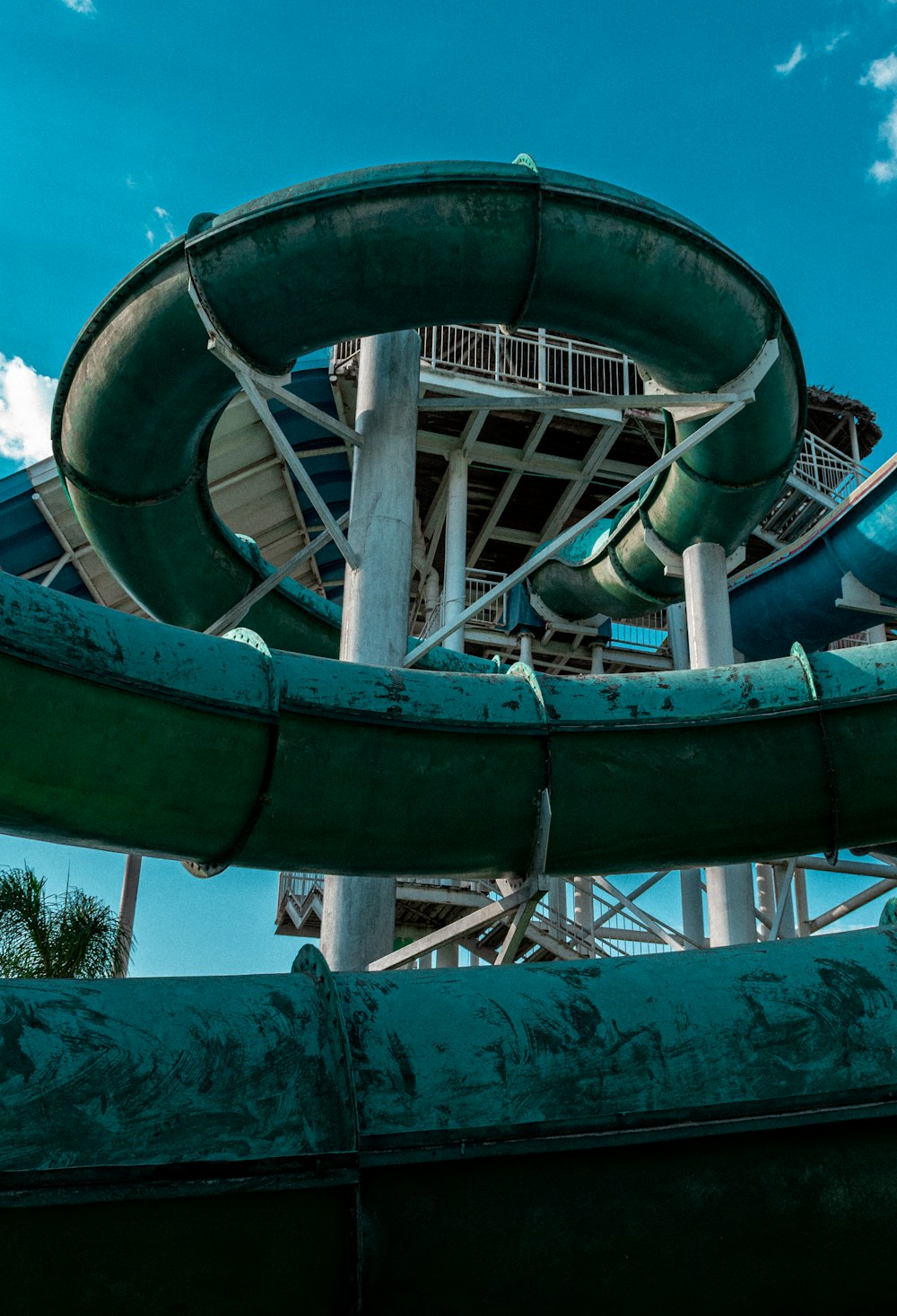 a water slide with a blue sky in the background