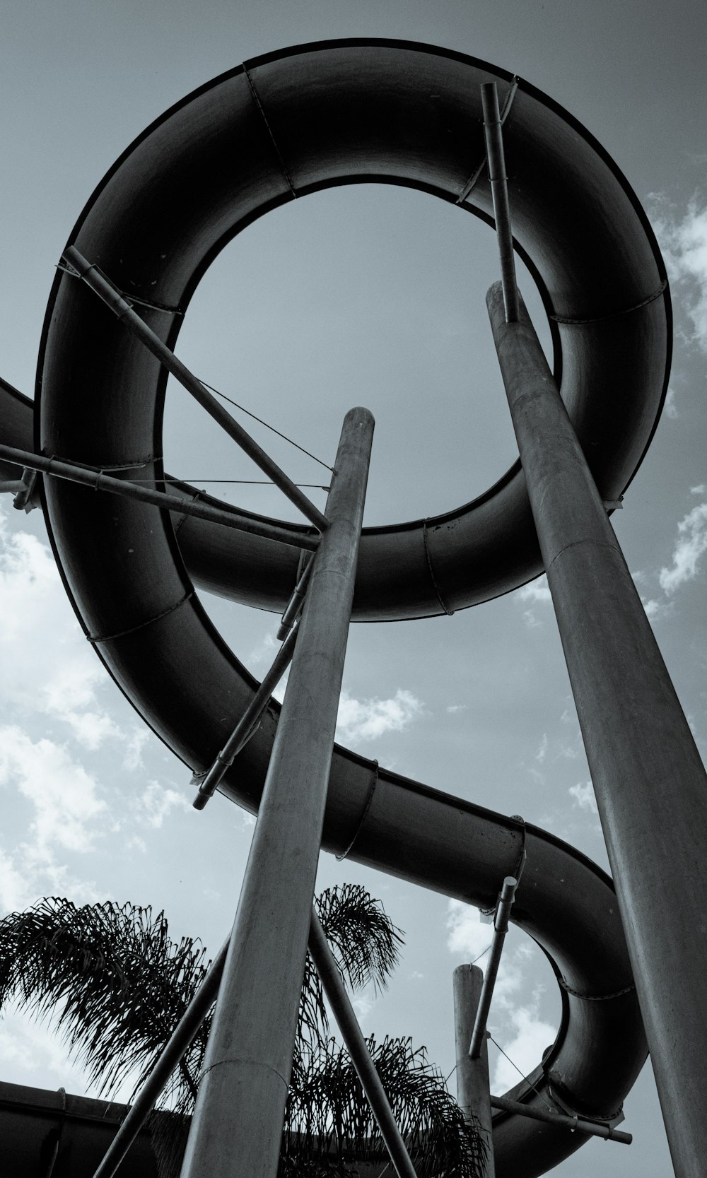 a black and white photo of a water slide