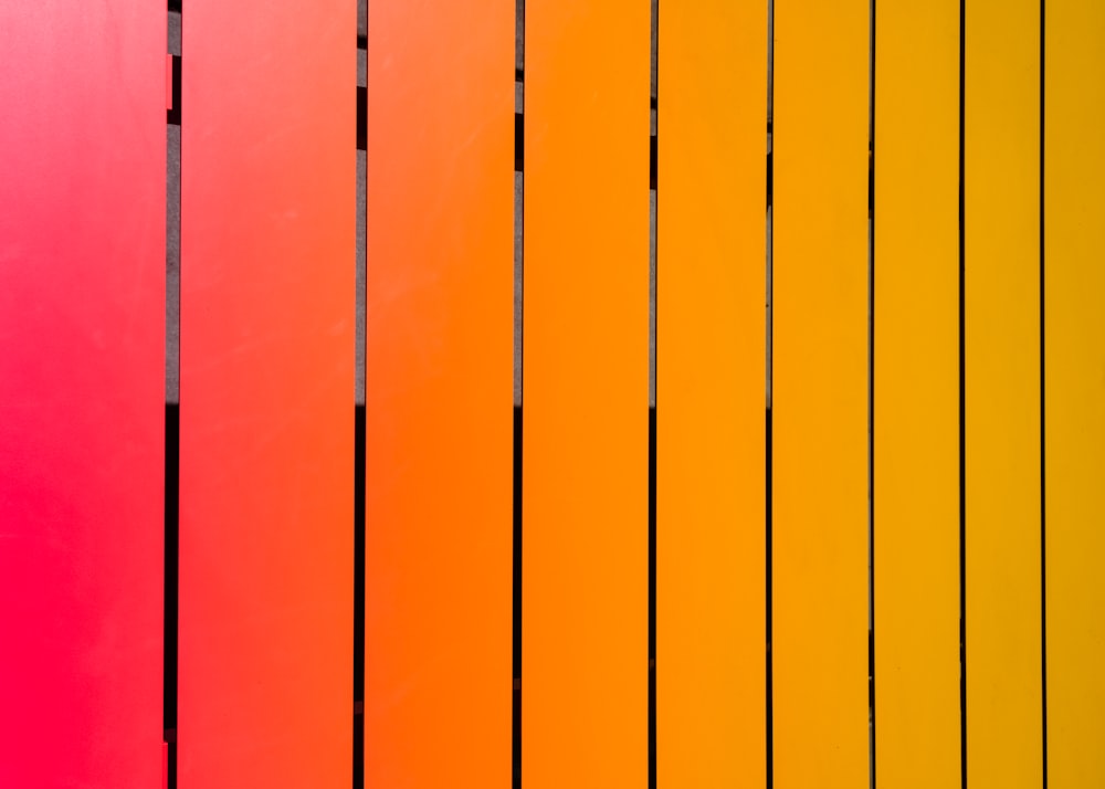 a close up of a rainbow colored wall