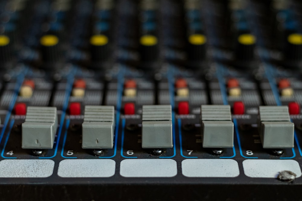 a close up of a sound mixing console