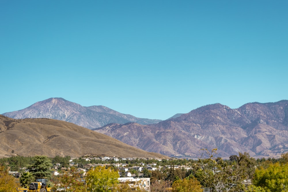 a view of a city with mountains in the background