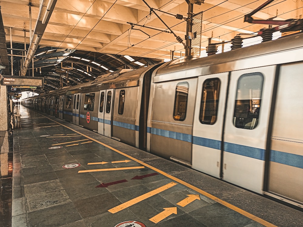 a subway train pulling into a train station