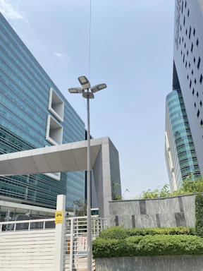 a street light in front of a tall building