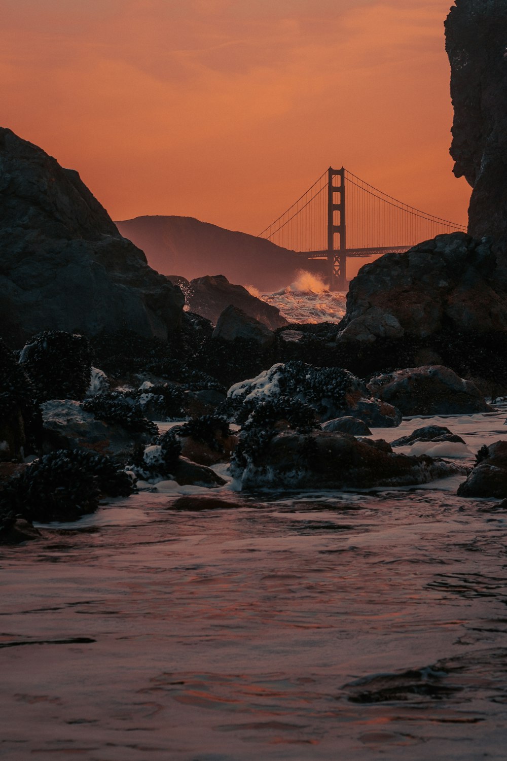 a view of the golden gate bridge at sunset