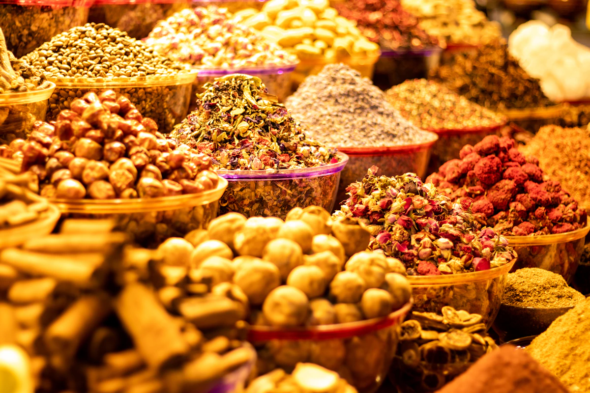 Colourful baskets of spices displayed inside Dubai Spice Souk