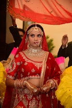 A bride wearing a stunning lehenga with elegant jewelry and makeup.