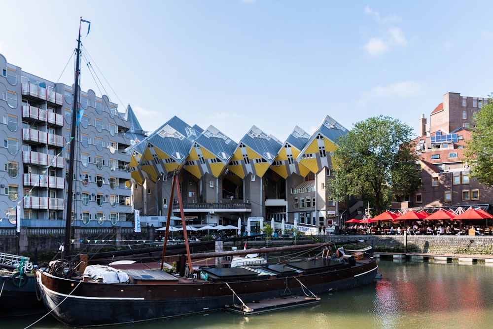 a row of boats sitting next to each other on a river