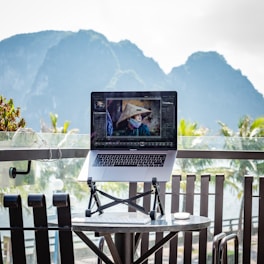 a laptop computer sitting on top of a table