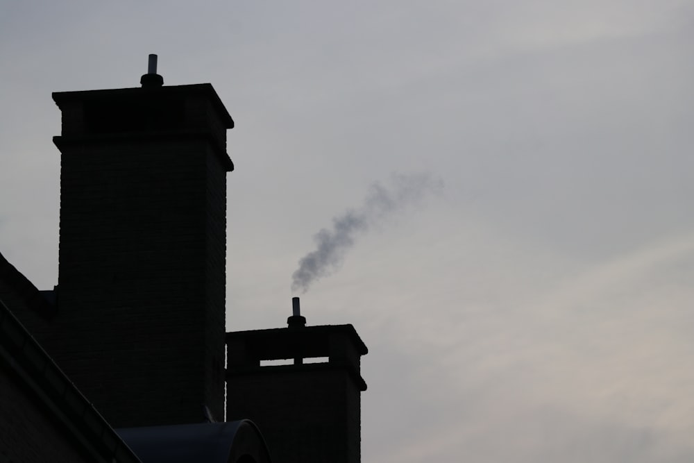 smoke coming out of a chimney of a building