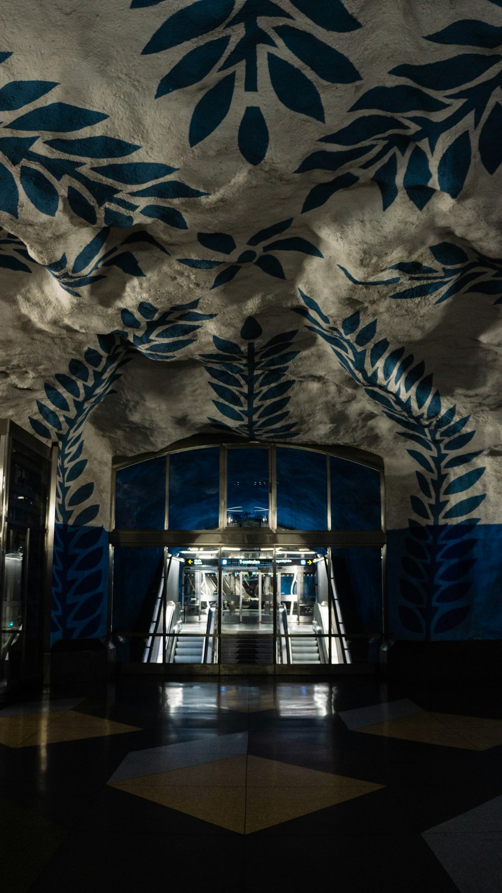 a large building with a blue and white mural on the ceiling