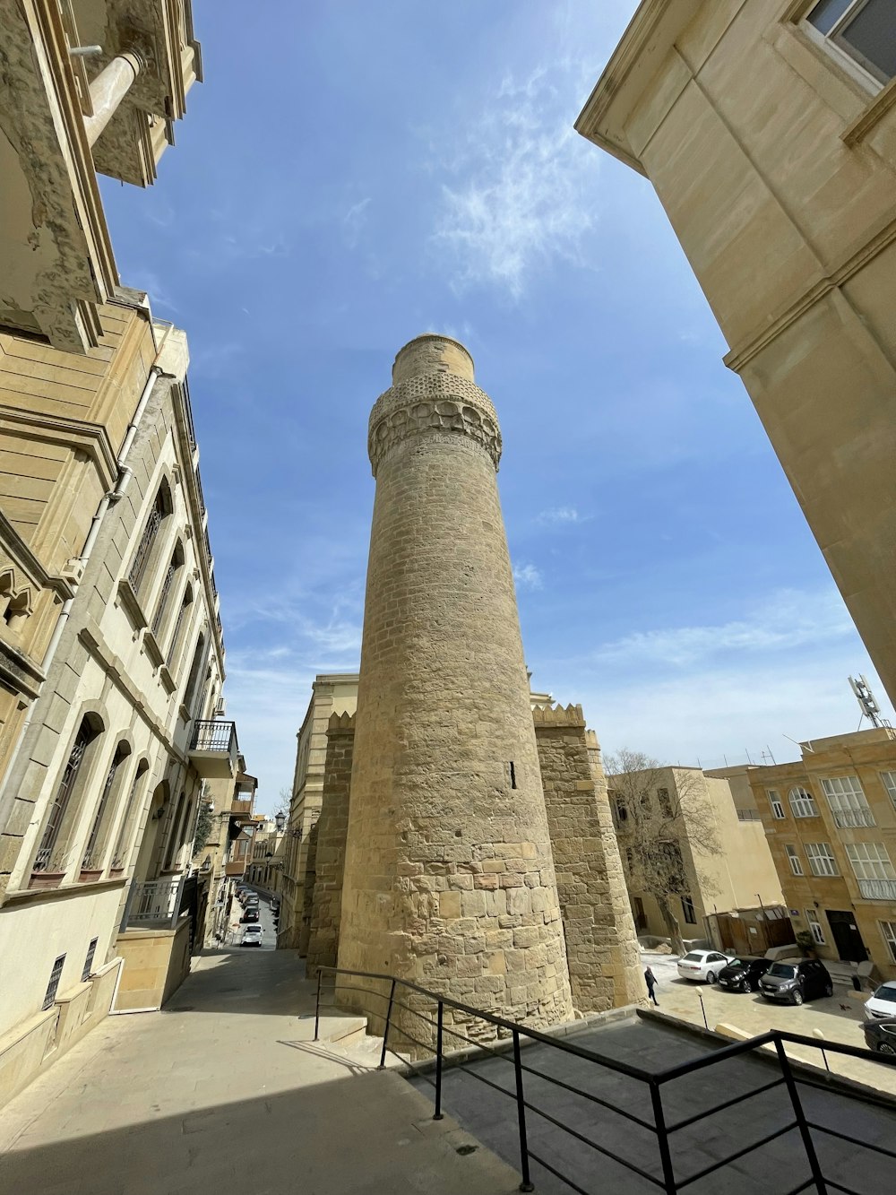 a tall stone tower sitting next to a building