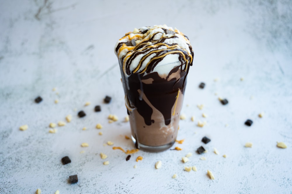a chocolate milkshake with a drizzle of chocolate on top