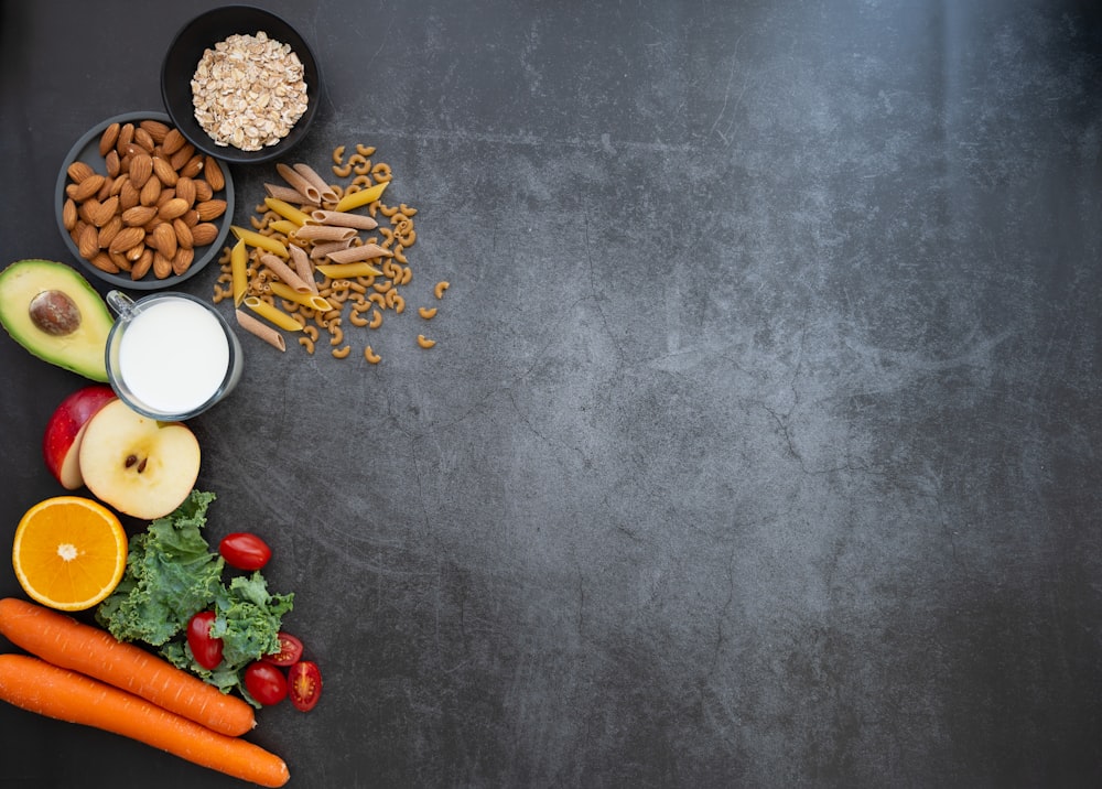 a black table topped with fruits and vegetables