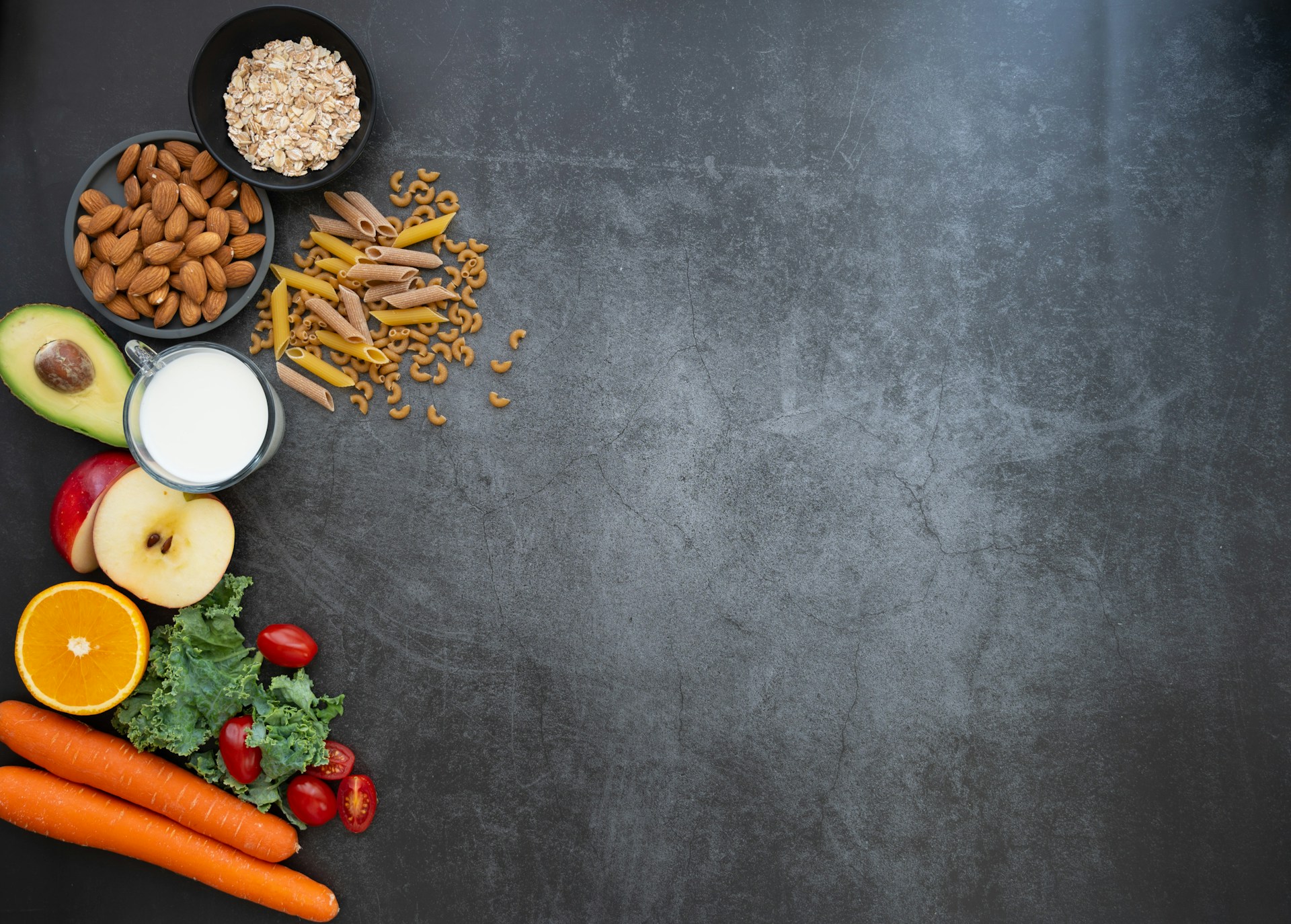 a black table topped with fruits and vegetables