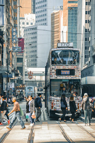 a double decker bus driving down a city street