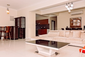 a living room filled with furniture and a table