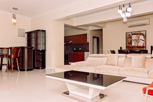 a living room filled with furniture and a table
