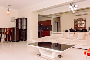 a living room filled with furniture and a table