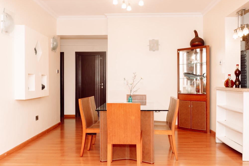 a dining room with a table and chairs