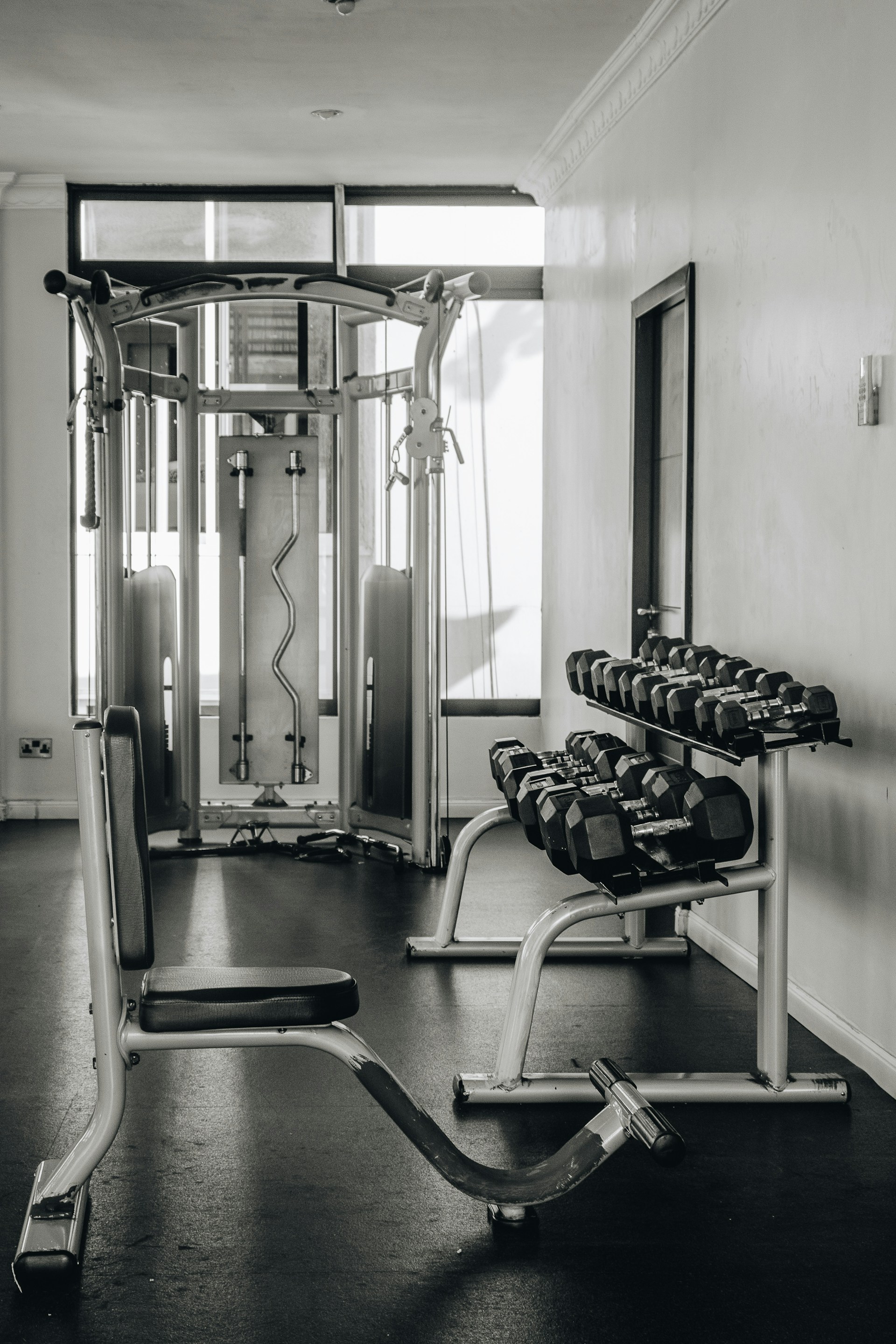 a black and white photo of a gym