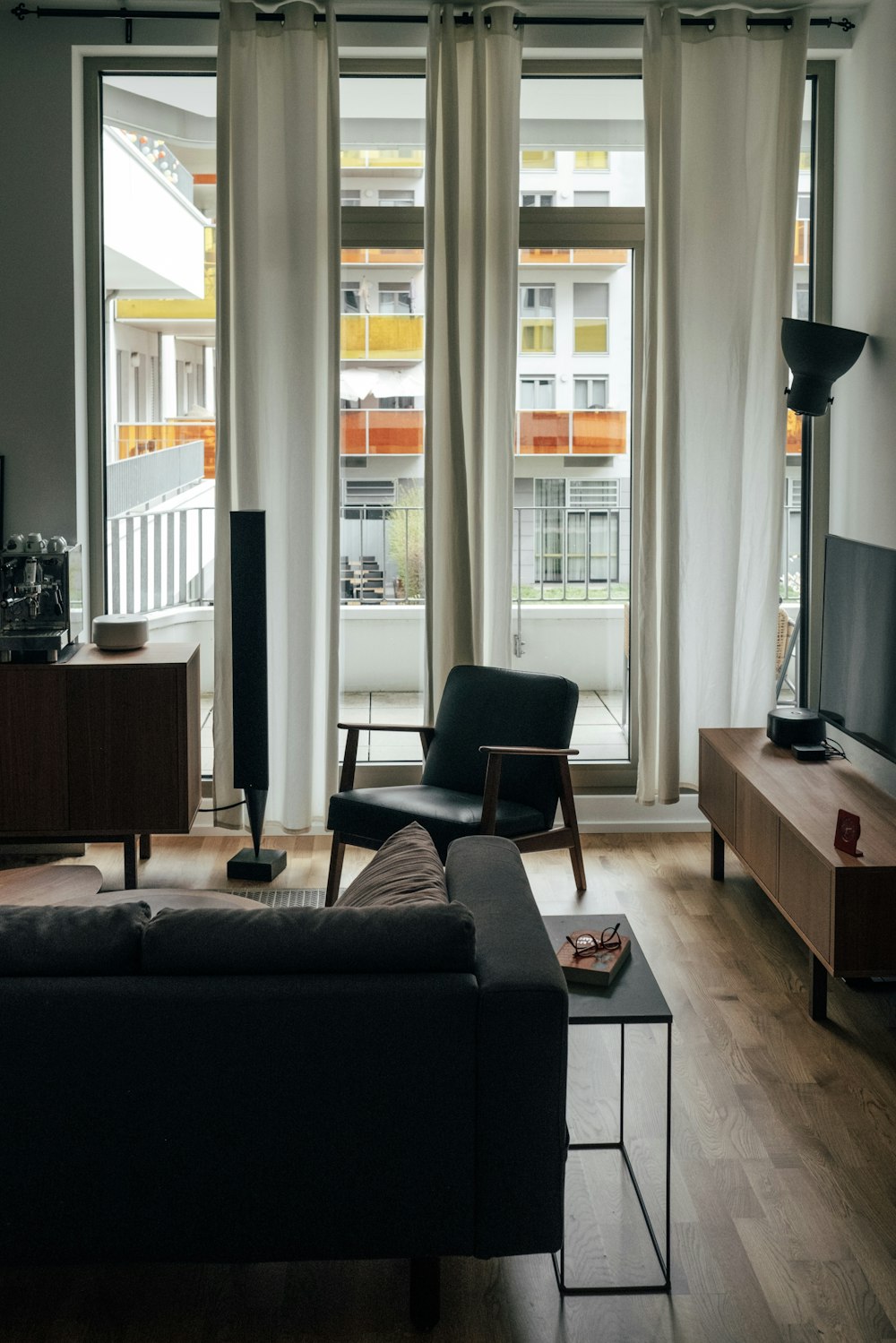 a living room filled with furniture and a flat screen tv