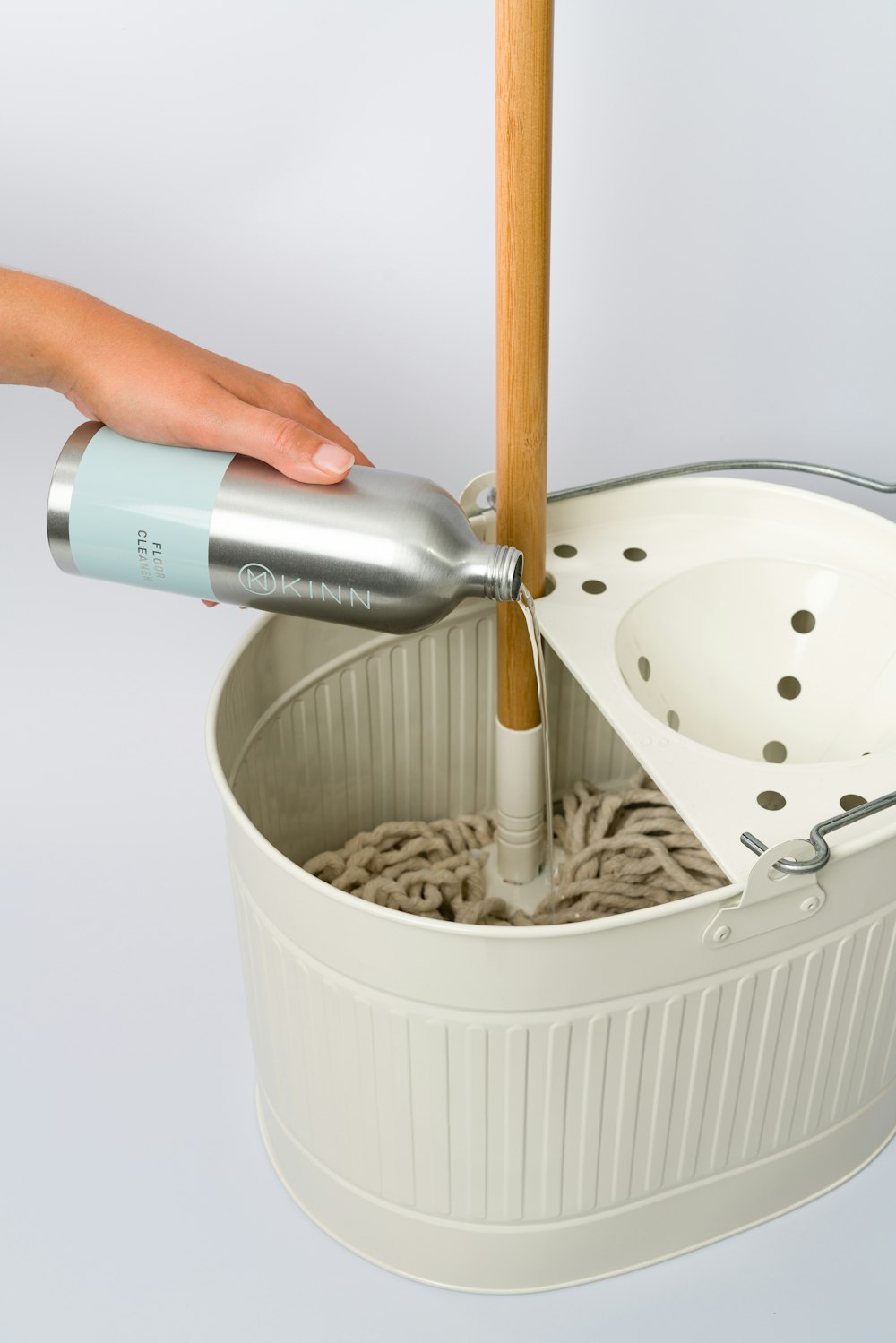 a person using a hair dryer to dry their hair