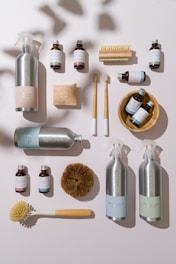 a collection of personal care products arranged on a white surface