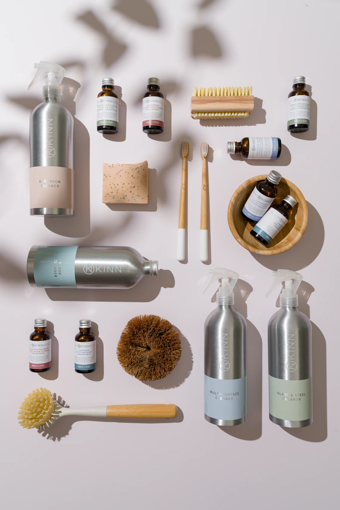 Personal care products and reusable bathroom essentials arranged on a clean surface